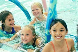 4 children playing in swimming pool