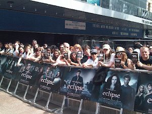 Handing out copies of The Hunger Games in the queue at the UK premiere of Eclipse.