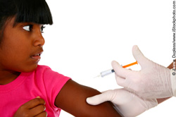 Young girl being given a vaccination Young girl being given a vaccination