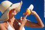 Woman applying sun cream