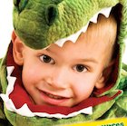 Boy wearing dinosaur outfit
