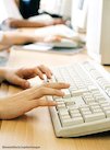 Childs hands typing on keyboard