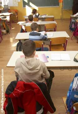 children sitting exam in classroom children sitting exam in classroom