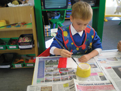 Young boy painting French flag Young boy painting French flag