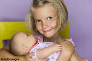 Girl with baby doll