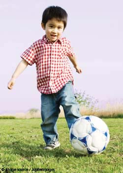 child with football