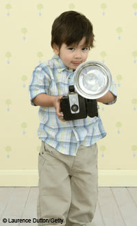 child with old-fashioned camera