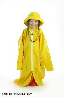 girl dressed in large raincoat